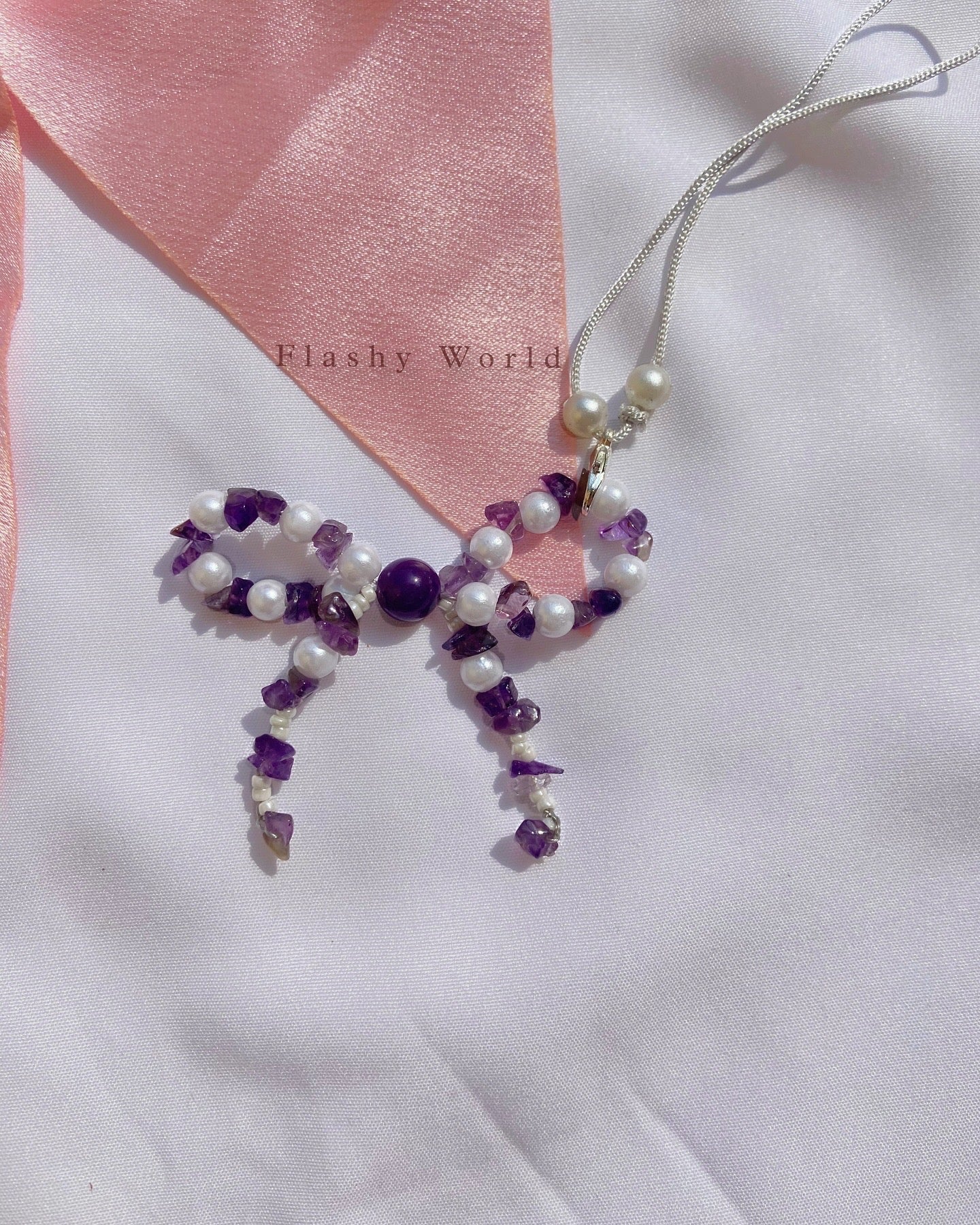 Aesthetic Amethyst & Pearl Bow Phone Charm – Handmade Crystal Phone Strap for Protection & Elegance