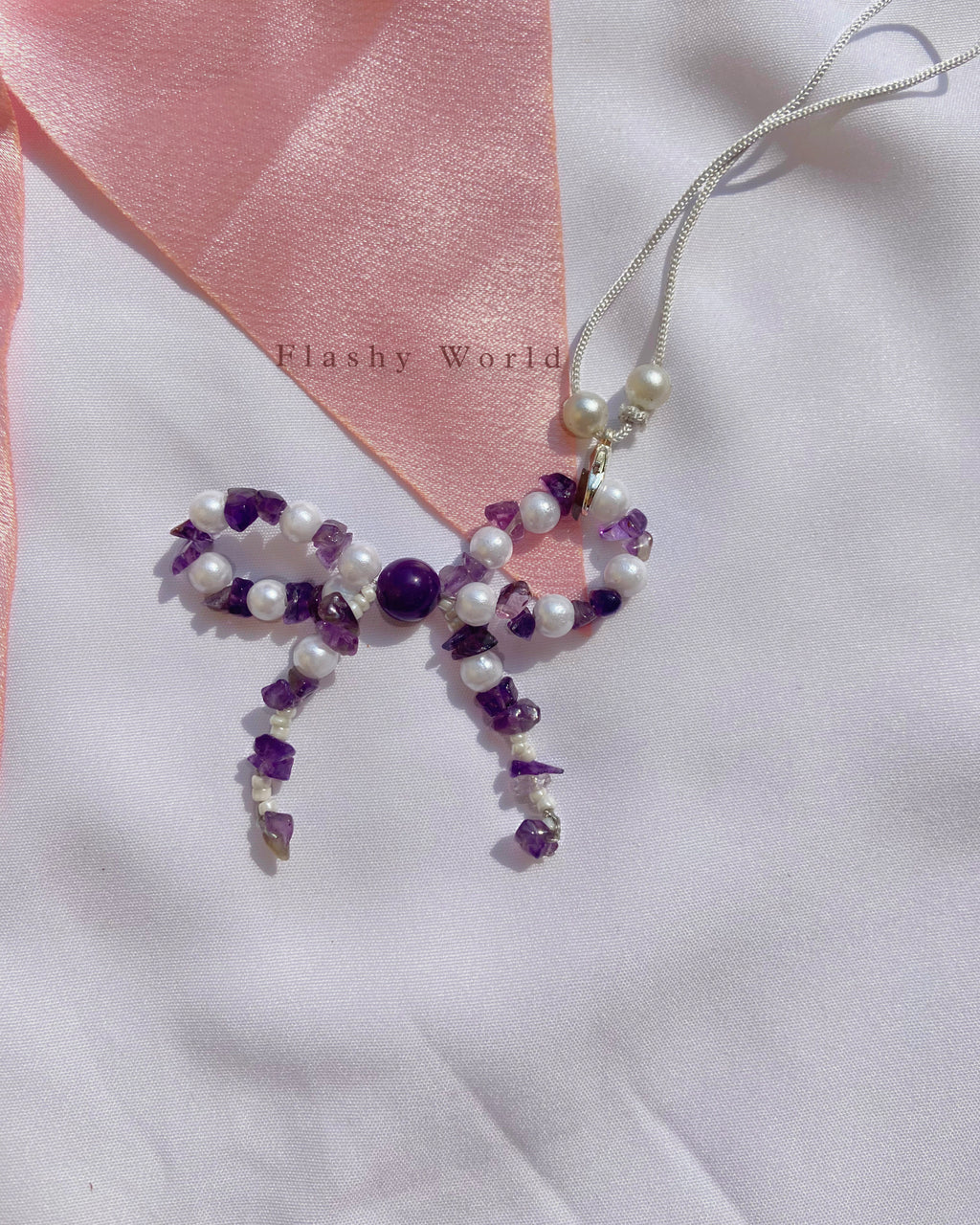 Aesthetic Amethyst & Pearl Bow Phone Charm – Handmade Crystal Phone Strap for Protection & Elegance
