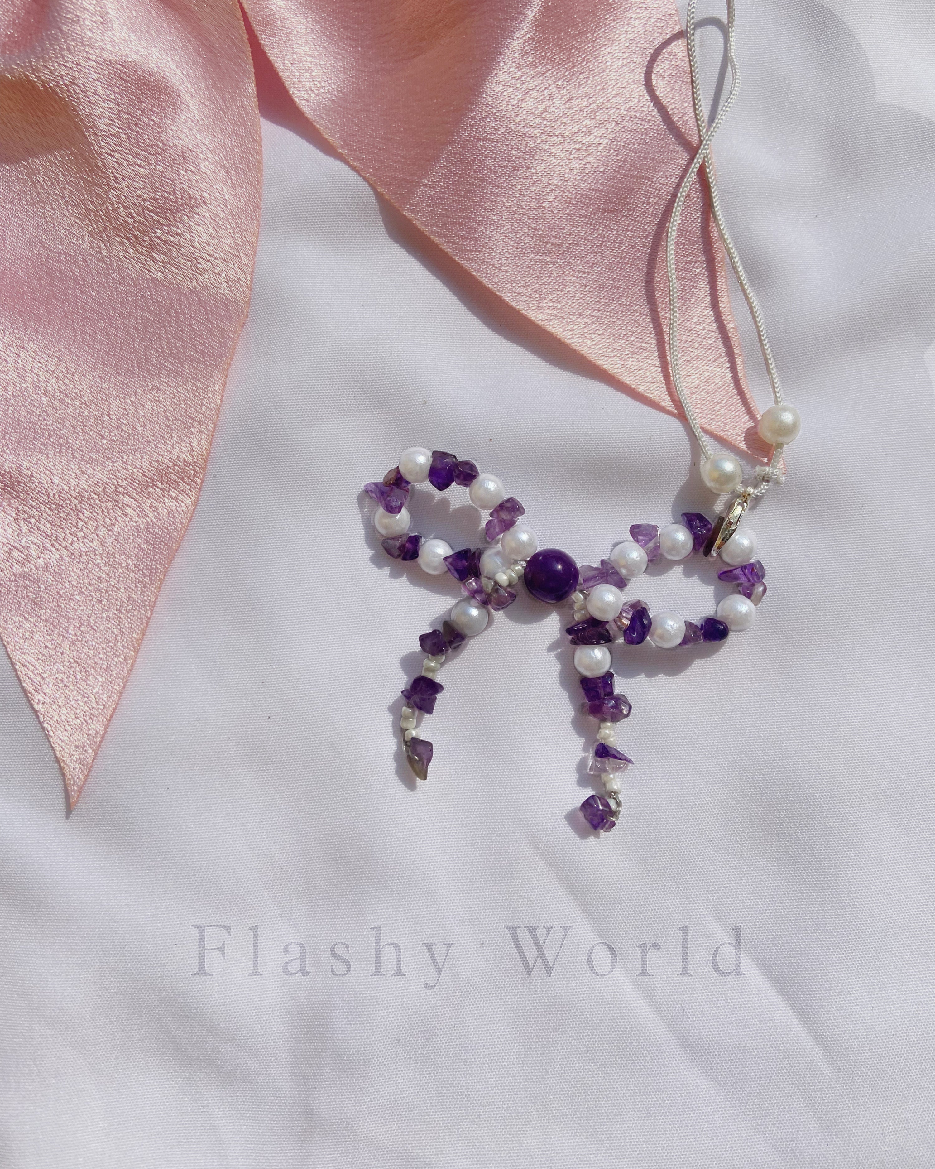 Aesthetic Amethyst & Pearl Bow Phone Charm – Handmade Crystal Phone Strap for Protection & Elegance