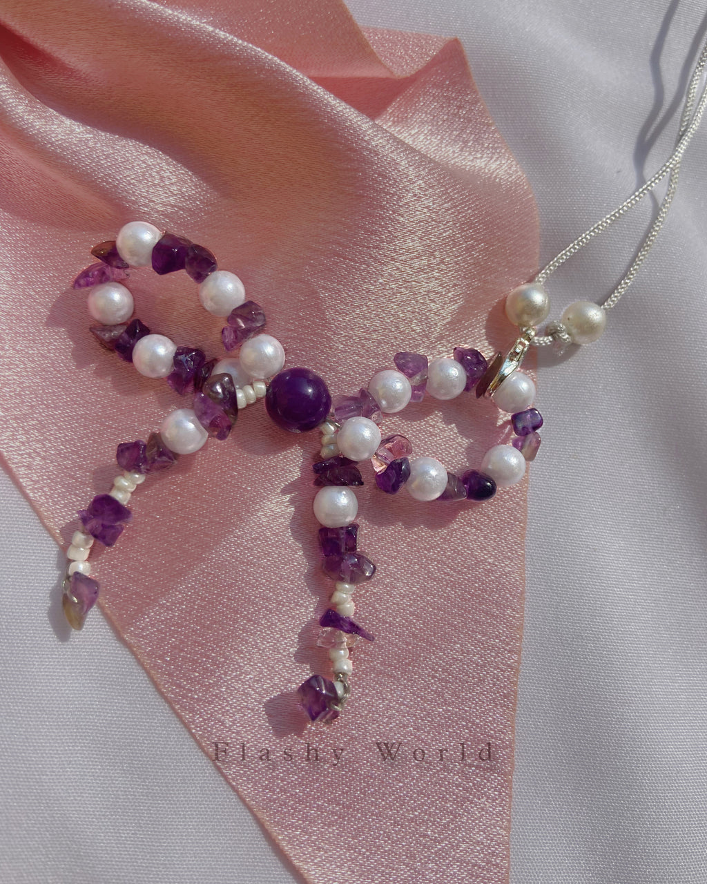 Aesthetic Amethyst & Pearl Bow Phone Charm – Handmade Crystal Phone Strap for Protection & Elegance