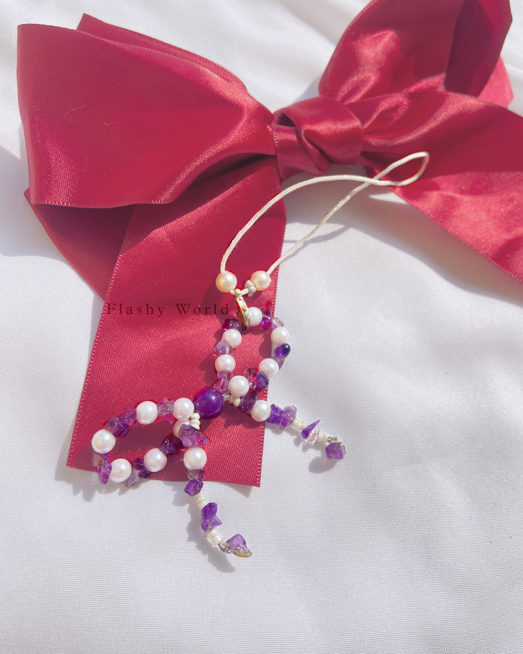 Aesthetic Amethyst & Pearl Bow Phone Charm – Handmade Crystal Phone Strap for Protection & Elegance